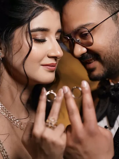 A romantic close-up of the couple. This shot highlights her beautiful eye makeup and soft features.