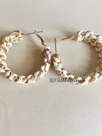 A pair of my white and gold macrame earrings. These are a beautiful gift idea for bridesmaids or for anyone who loves handmade jewelry.