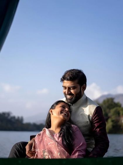 A happy moment shared on a boat ride in Naukuchiatal, showcasing the fun and relaxed side of a destination wedding.