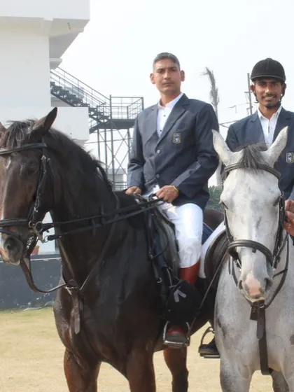 Two of our instructors, mounted on their horses in formal attire, represent the expertise and leadership at our academy.