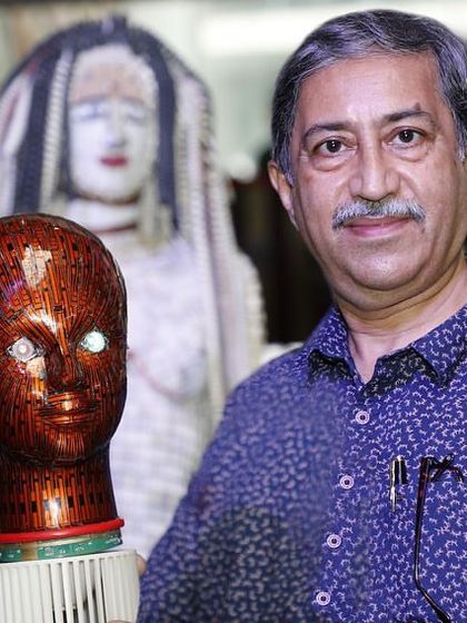 A photo from my exhibition at Nexus Mall, where I am holding one of my signature e-waste bust sculptures. This is the kind of unique, handcrafted art that I am passionate about creating.