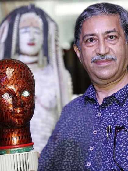 A photo from my exhibition at Nexus Mall, where I am holding one of my signature e-waste bust sculptures. This is the kind of unique, handcrafted art that I am passionate about creating.