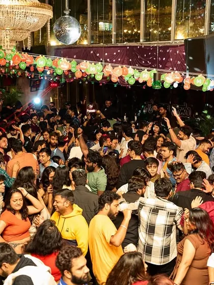A wide shot of the incredible turnout at Sarjapur Social. The entire venue was bouncing, filled with decorations and an unbeatable festive spirit.