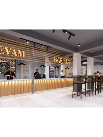 The spacious bar and high-top seating area at Evam Barista, designed with a clean, industrial look.