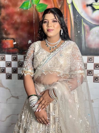 A full view of the party-ready client. The hairstyle adds a touch of glamour without overpowering her detailed outfit.