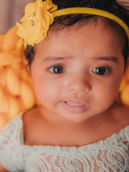 That sweet, gentle expression is just precious. Close-up portraits like this are a must-have from any milestone session.