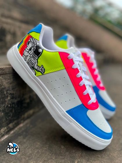 A side view of the astronaut-themed Campus sneaker, highlighting the bright neon yellow and pink color blocking.