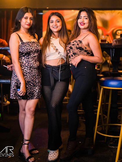 A group of friends dressed in stylish outfits.