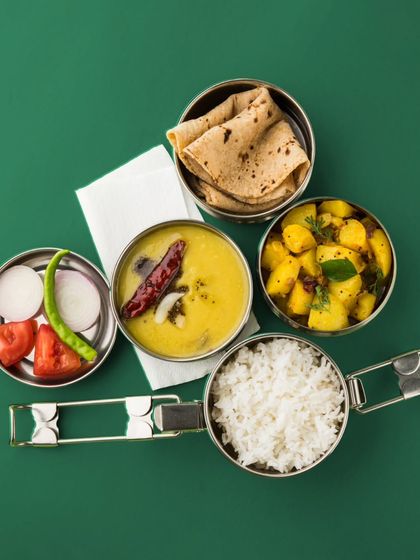 There’s something magical about a meal that takes you back to simpler times. Our steel tiffins are packed with that nostalgic, home-style goodness.