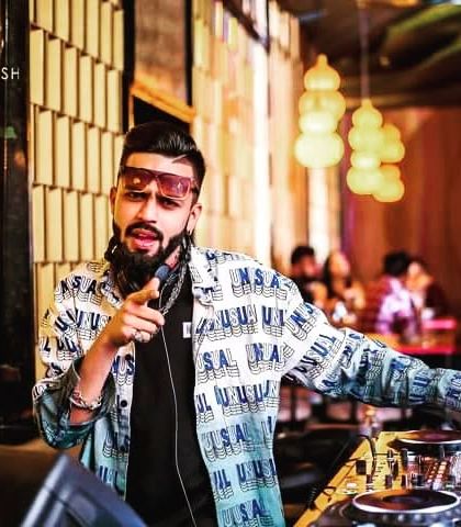 Hey you, yes you. A photo of me pointing at the camera, inviting you to join the party at Badmaash Lounge.