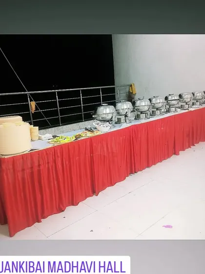 A clean and simple buffet line ready for service at Jankibai Madhavi Hall. This is a practical setup for hall-based events.