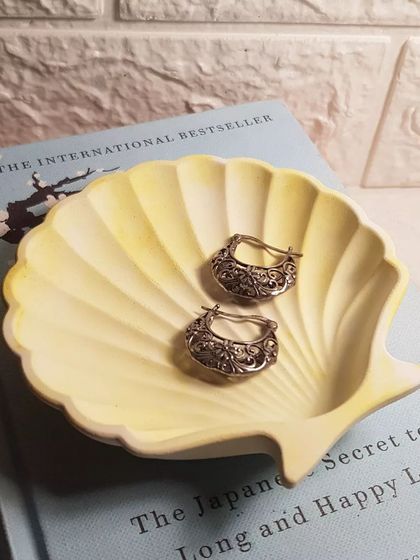 Our mini shell dish in a lovely pastel yellow, perfect for holding small, delicate earrings.