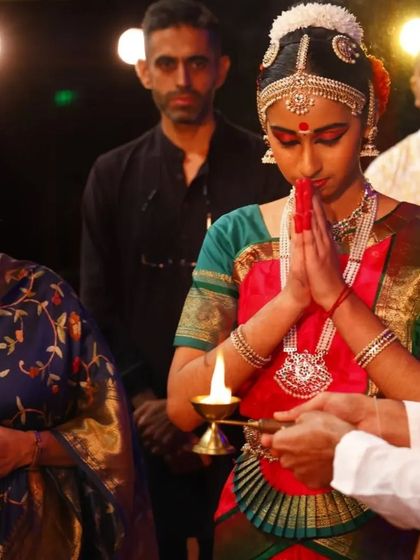 The pre-performance rituals are as important as the dance itself. Here, my student Sahana participates in the lamp lighting ceremony to begin her Arangetram.