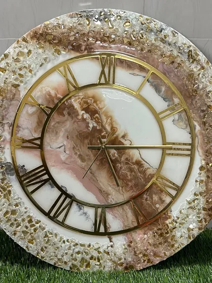 A large and luxurious clock with a full crystal border and a beautiful brown and white marble center.