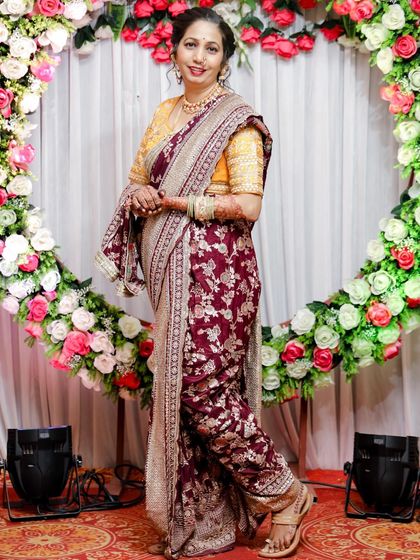Another elegant pose from a client in the maroon floral Nauvari.