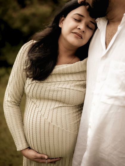 A quiet, tender moment. She rests her head on his chest, eyes closed, finding comfort and peace in his embrace. A beautiful portrait of trust and love.