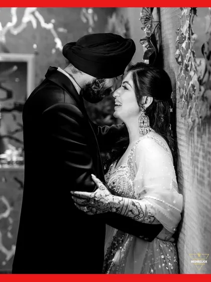 A beautiful black and white portrait, capturing the couple's laughter and genuine connection in an intimate moment.