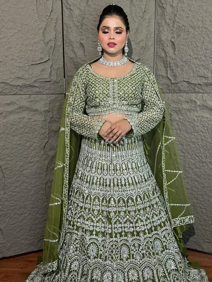 This olive green lehenga with heavy silver embroidery is a showstopper. It’s a fantastic rental option for a bride or bridesmaid for a sangeet or reception.