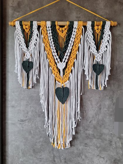 Bring the bohemian vibe into your home with our stunning handmade Macrame wall hanging. The bold colors and intricate patterns make it a true statement piece.