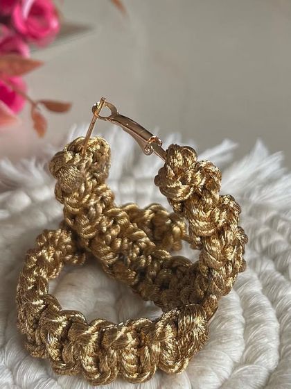 Another look at the golden hoops. They are a great accessory for when you want something that is handmade, unique, and has a bit of sparkle.