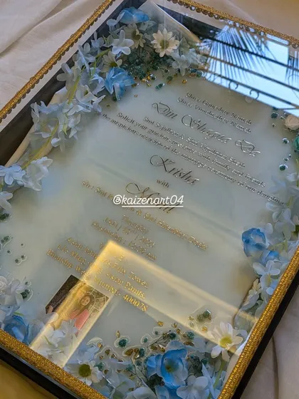 The reflection on this blue resin invitation shows how clear and glossy the finish is. It's a truly premium and unique way to invite your guests.