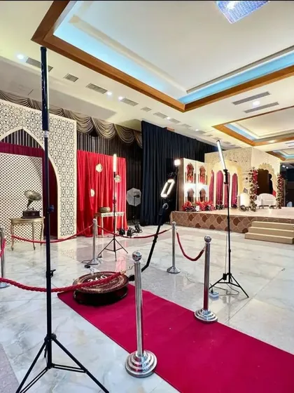 Another angle of the wedding setup, showing how it integrates into the main event space. The booth is positioned to attract guests without disrupting the flow of the celebration, providing a fun and interactive activity.