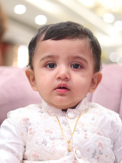A direct and engaging close-up portrait of a baby boy. We use lighting and focus to create high-quality portraits that highlight your child's features.