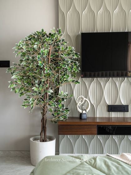 A close-up of our 3D textured wall paneling. This detail adds a perfect interplay of form and finish, bringing depth and dimension to the space, especially when accented with warm wood tones and curated decor.