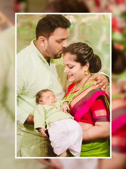 A tender moment between new parents and their baby. The father's gentle kiss on the baby's forehead is a memory to be treasured.