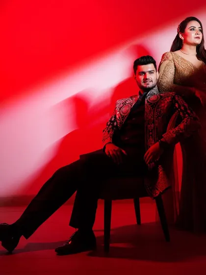 A dramatic, high-fashion portrait using bold red lighting to create a glamorous, magazine-style look. This showcases my ability to craft stylized, Bollywood-inspired pre-wedding photos.