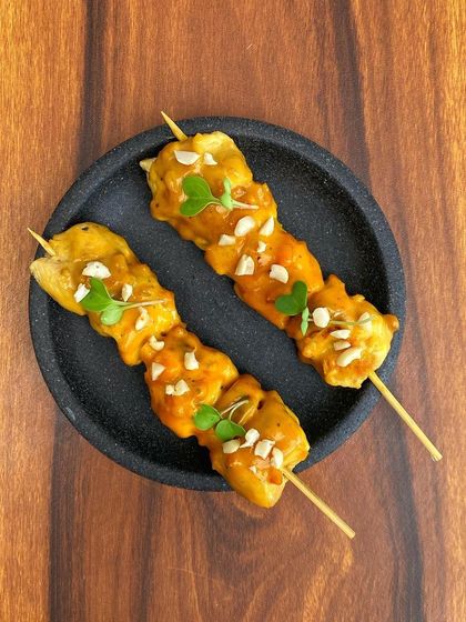 Classic Chicken Satay skewers from our 'Bangkok Joes' menu, grilled and served with a rich peanut sauce and crushed nuts.