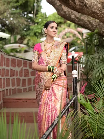 Our beautiful Maharashtrian bride, ready for her reception in a stunning pink and gold Kanjeevaram tissue saree.