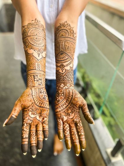 A beautiful engagement henna design with a mix of mandalas and other traditional patterns.