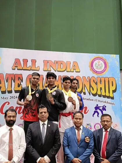 The winners of the senior national karate championship in Dehradun on the podium, including our student Harshit.