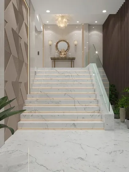 For this lobby in Nerul, we designed a grand marble staircase with a minimalist glass railing to create an open and impressive entryway. The combination of textured wall panels, ambient lighting, and integrated planters demonstrates our skill in creating layered, sophisticated commercial spaces.