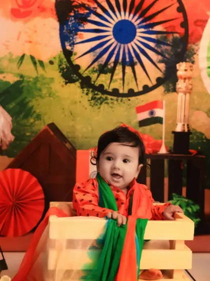 Celebrating Independence Day with patriotic flair. This baby is dressed in the colors of the flag, creating a proud and adorable portrait.