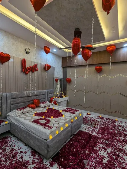 For a classic romantic surprise, I use a combination of heart-shaped foil balloons, rose petals, and safe LED candles. This setup is perfect for anniversaries, birthdays, or just to show someone how much you care.