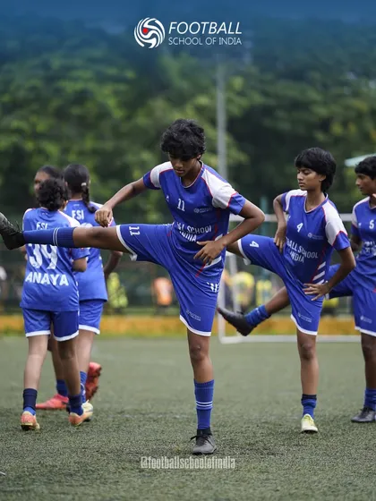 Flexibility and injury prevention are key. Our girls' team performs dynamic stretches as part of their warm-up routine before a competitive training session.