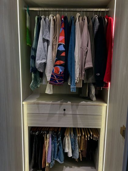 A closet section with two levels of hanging space, perfect for separating tops from trousers or skirts.