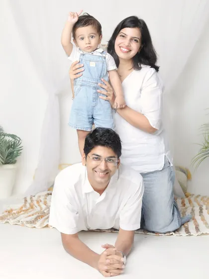 A fun and playful family pose. Stacking poses like this are a great way to create a unique and connected family portrait.