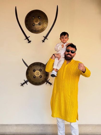 Matching with my little one. My son's outfit is crafted from our breathable Chanderi, while my vibrant yellow kurta is made from our best-selling slub silk.