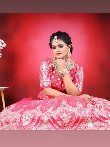 A pensive and beautiful shot, highlighting the flawless makeup and intricate jewellery.