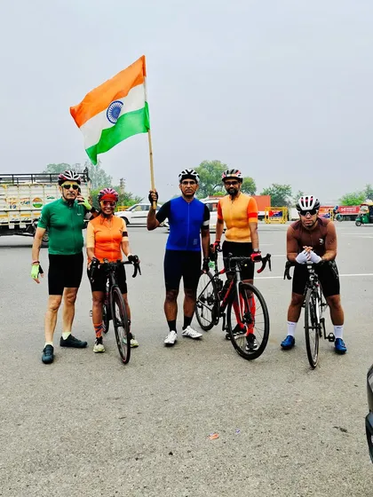 The group stands together with the flag, showing our unity and pride on Independence Day.