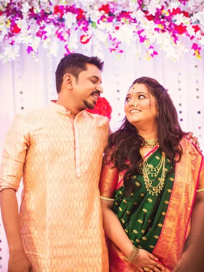 A lovely couple portrait from an engagement party. The bride's makeup is radiant, and her open hairstyle is perfect for the celebratory atmosphere.