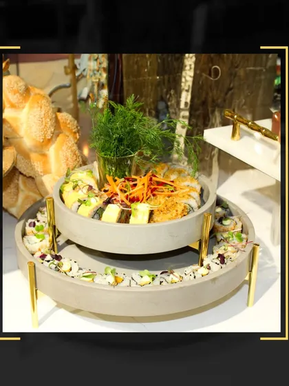 From our curated setups to the last bite, we create memorable dining experiences. This two-tiered platter of assorted sushi rolls was a centerpiece at a recent event.