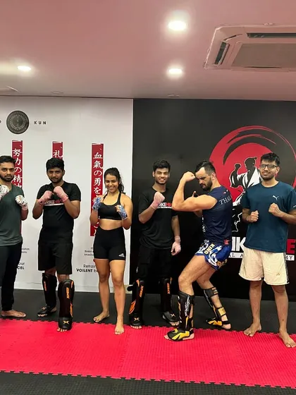 The class poses with a guest coach after an intense session, showing our commitment to bringing diverse expertise to our students.
