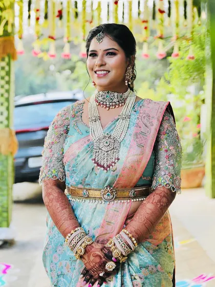 A happy and confident bride, her smile is the best accessory to her beautiful mehendi.