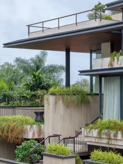 A closer look at the tiered planters and staircases that animate the facade, creating a dynamic relationship between the building and its landscape.