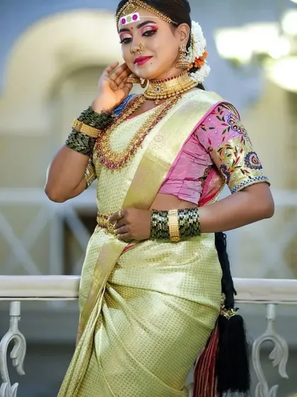 A full-length shot showing the beautiful drape of the saree and how our vaddanam and layered necklaces complete the silhouette.