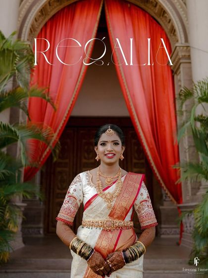 A regal portrait of the bride in her white and red saree, titled "Regalia."